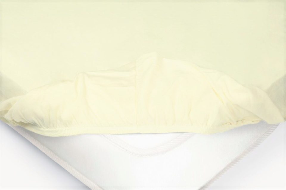 Детская простыня на резинке Трикотажная нежно-желтая